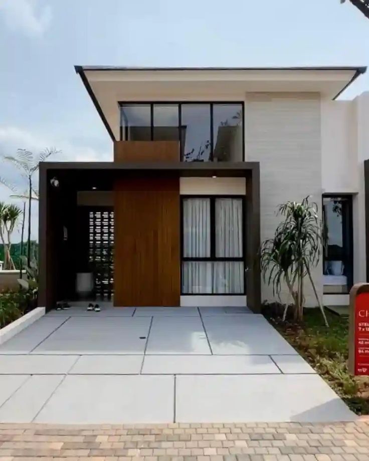 Fasad Minimalis dengan Carport Terintegrasi Fasad Minimalis dengan Carport Terintegrasi